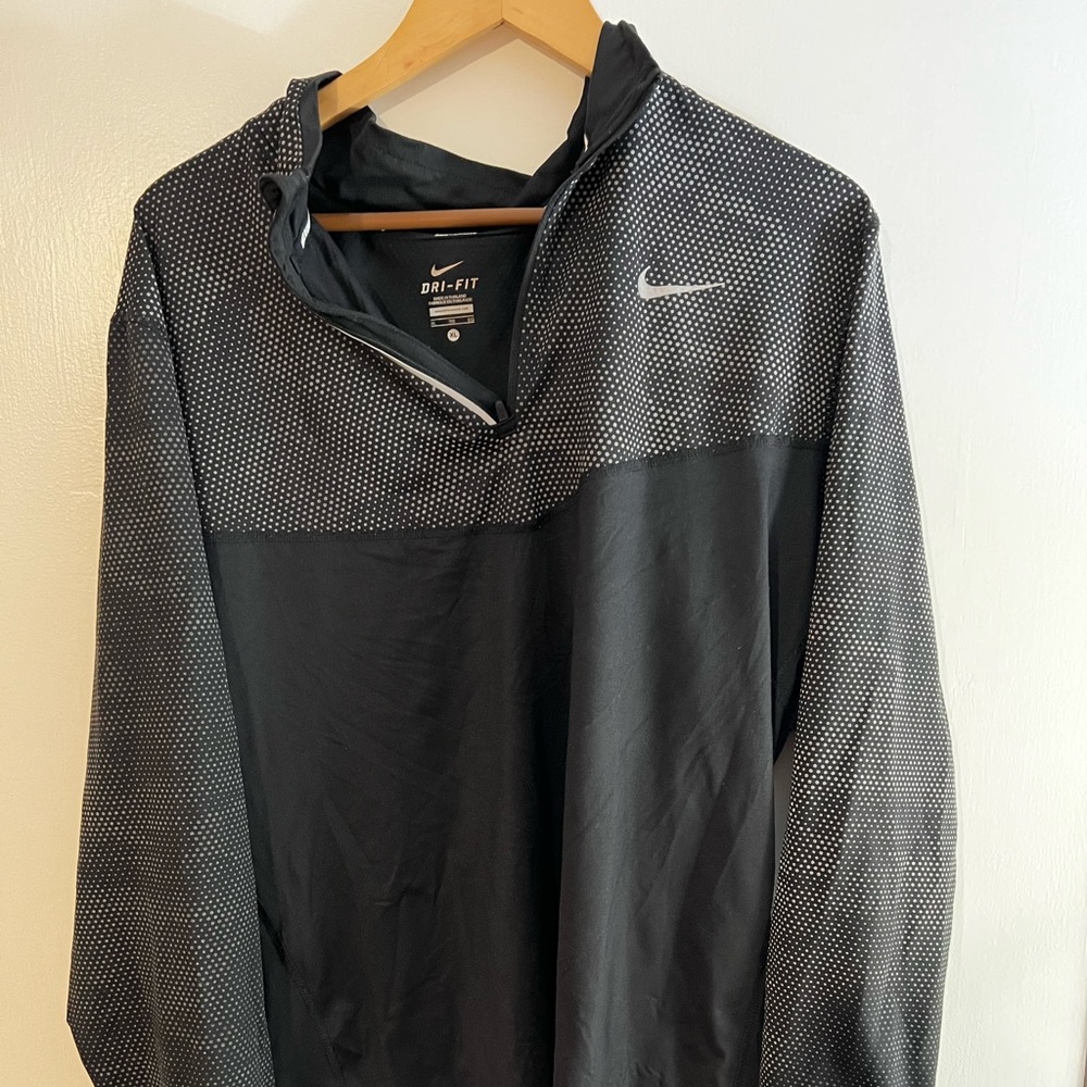 Nike Dri Fit XL crew neck running jacket with reflective coating.